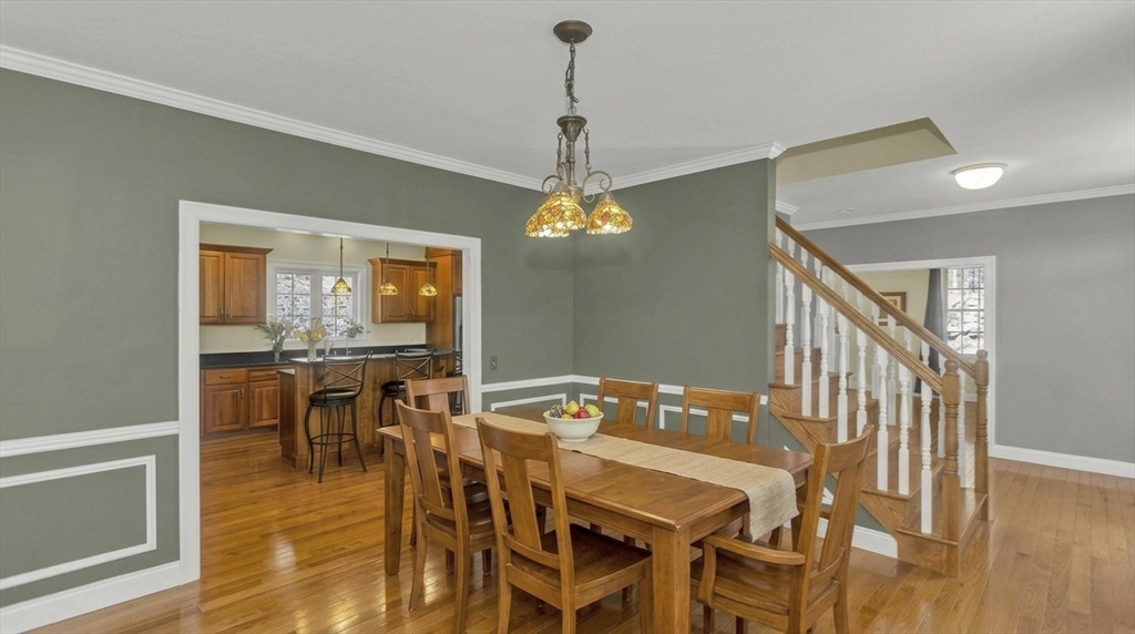 333 Stebbins Street Belchertown, MA 01007 - Photo 15 of 42 a view of a dining room with furniture window and wooden floor