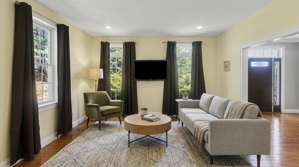 333 Stebbins Street Belchertown, MA 01007 - Photo 16 of 42 a living room with furniture and a large window