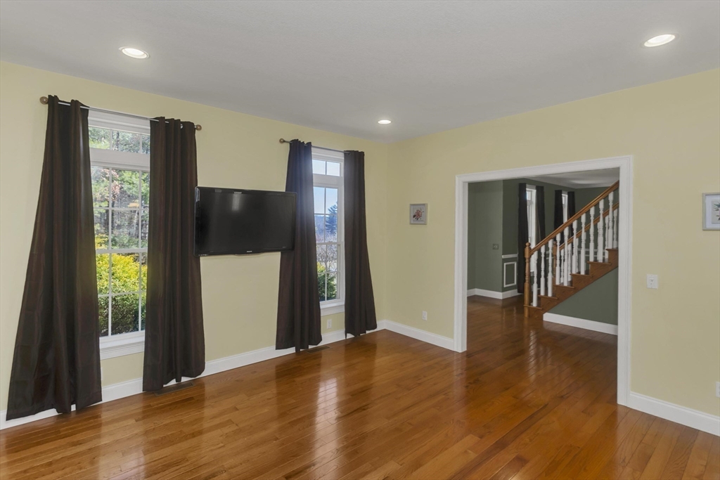 333 Stebbins Street Belchertown, MA 01007 - Photo 17 of 42 a view of a hallway with wooden floor and staircase