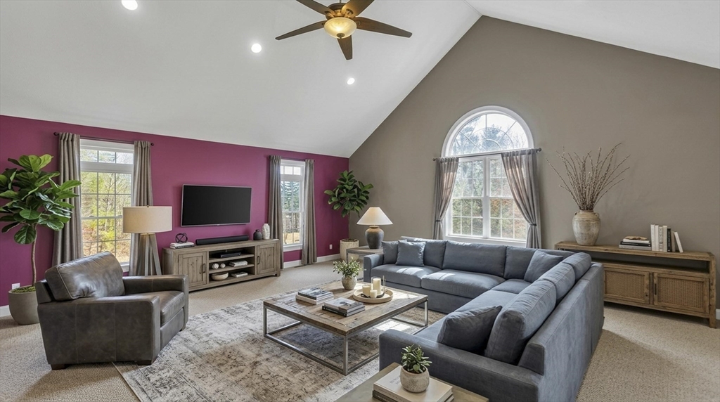 333 Stebbins Street Belchertown, MA 01007 - Photo 20 of 42 a living room with furniture a large window and a flat screen tv