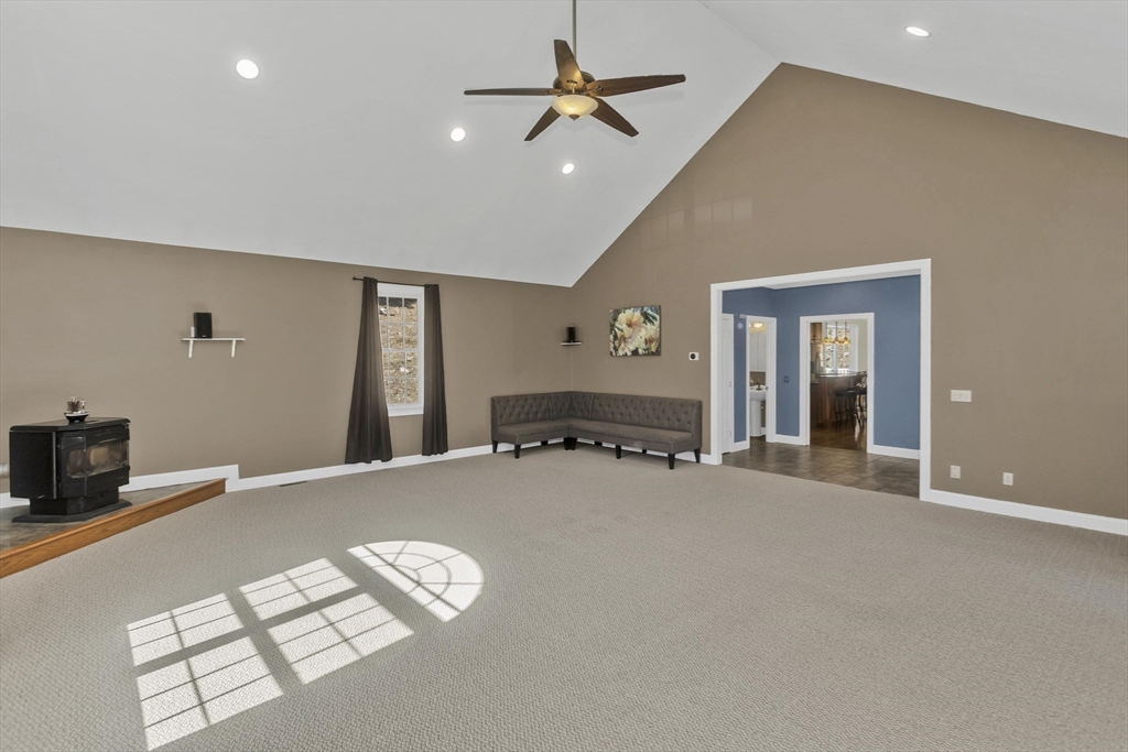 333 Stebbins Street Belchertown, MA 01007 - Photo 21 of 42 a living room with furniture and a ceiling fan