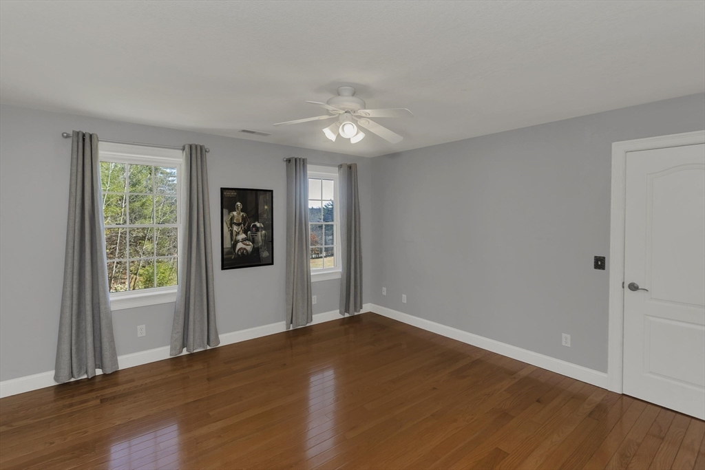 333 Stebbins Street Belchertown, MA 01007 - Photo 26 of 42 a view of an empty room with wooden floor and a window