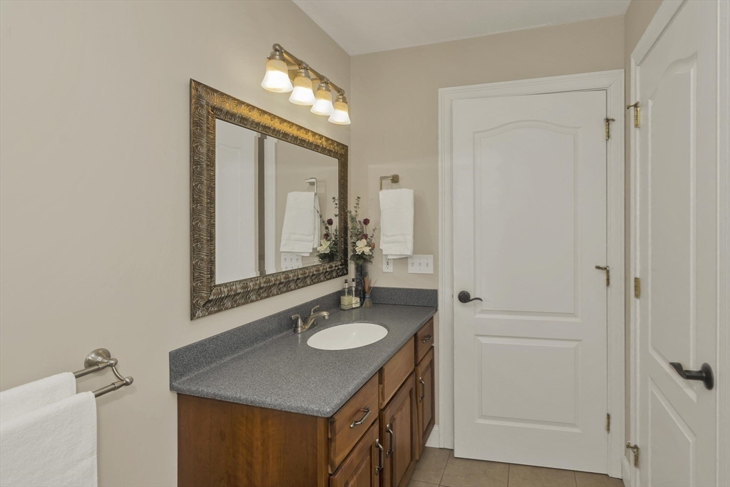 333 Stebbins Street Belchertown, MA 01007 - Photo 28 of 42 a bathroom with a sink vanity granite and a mirror