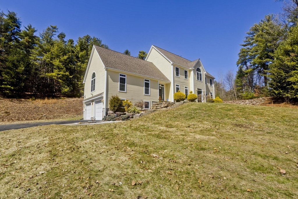 333 Stebbins Street Belchertown, MA 01007 - Photo 3 of 42 a front view of a house with a yard