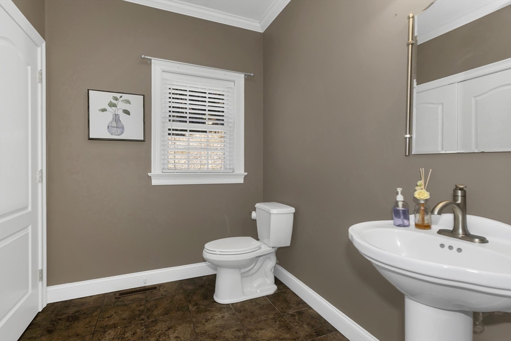 333 Stebbins Street Belchertown, MA 01007 - Photo 32 of 42 a bathroom with a toilet sink and mirror