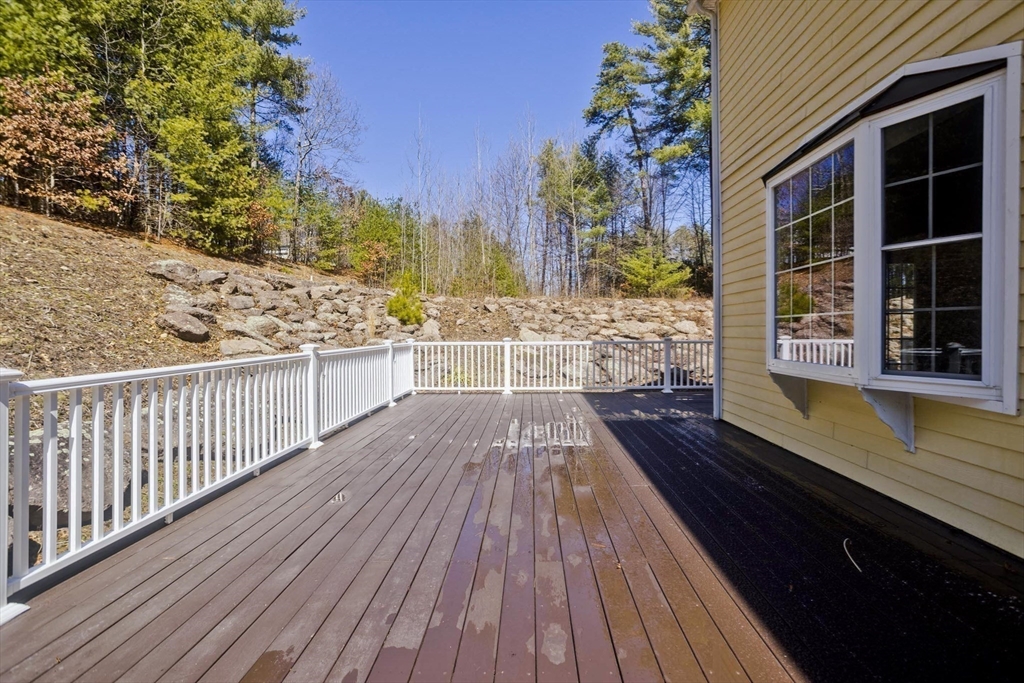 333 Stebbins Street Belchertown, MA 01007 - Photo 36 of 42 a view of balcony with wooden floor and potted plants