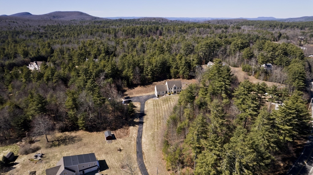 333 Stebbins Street Belchertown, MA 01007 - Photo 37 of 42 a view of a city with lush green forest