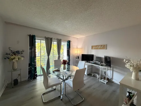 a workspace with furniture window and wooden floor