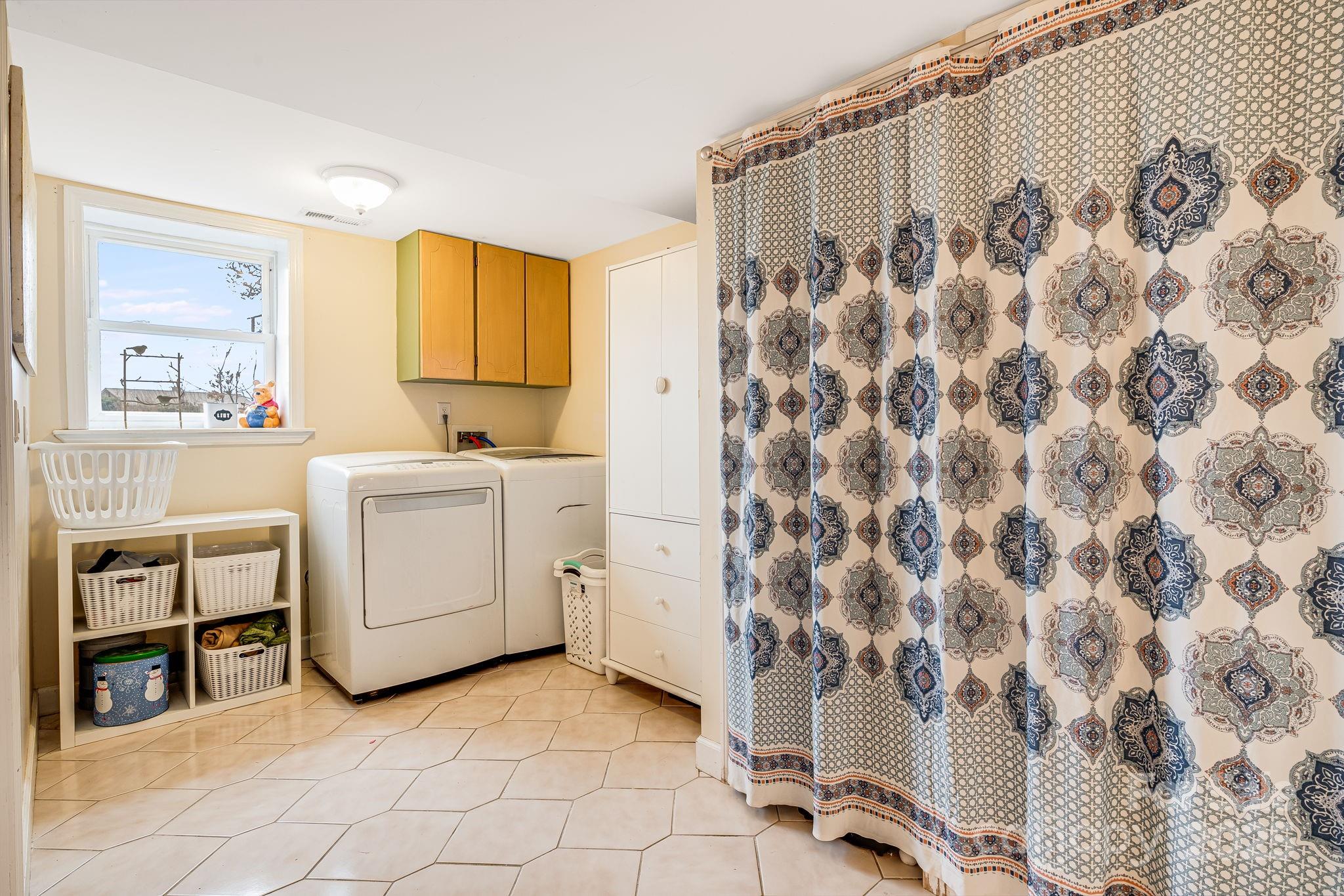 195 Whitmire Road Brevard, NC 28712 - Photo 20 of 30 a view of a storage & utility room with two washing machine