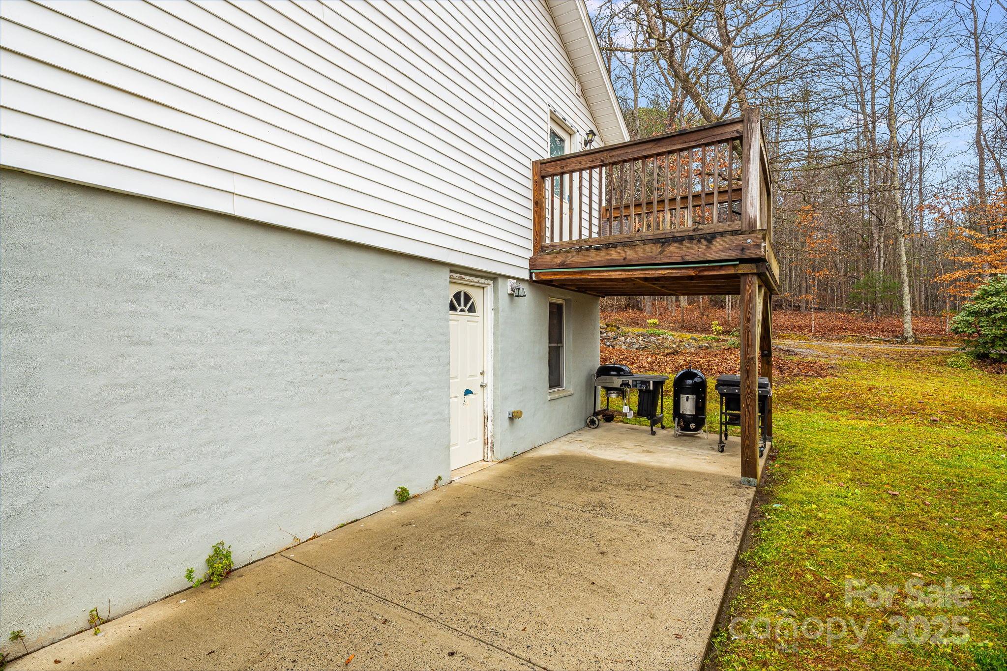 195 Whitmire Road Brevard, NC 28712 - Photo 23 of 30 a view of a livingroom with furniture and a patio