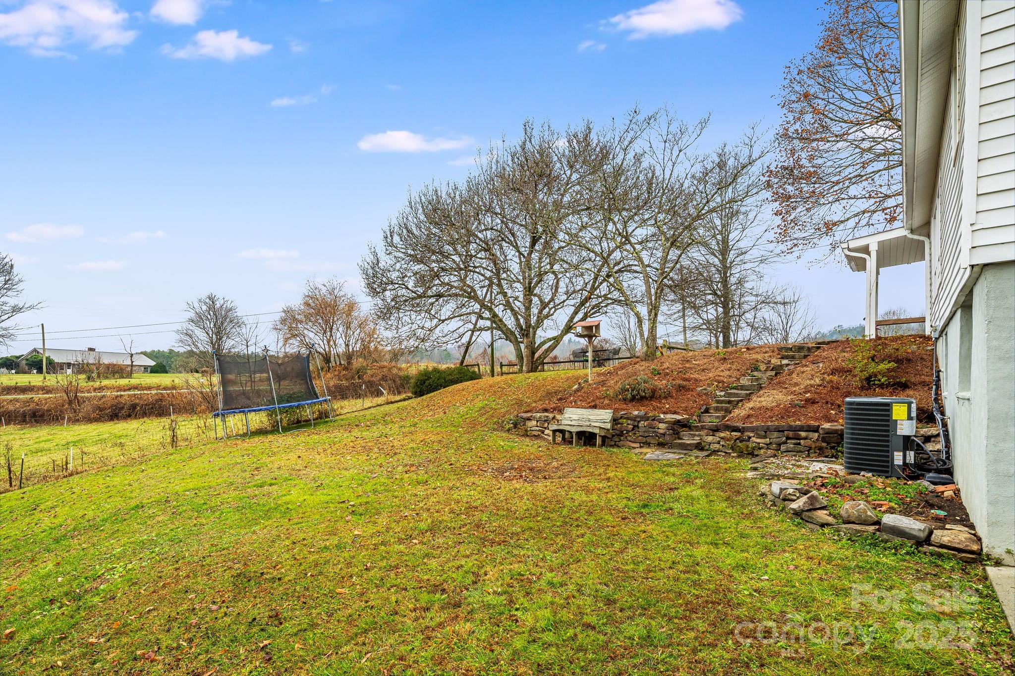 195 Whitmire Road Brevard, NC 28712 - Photo 24 of 30 a view of a swimming pool with an outdoor space and seating area