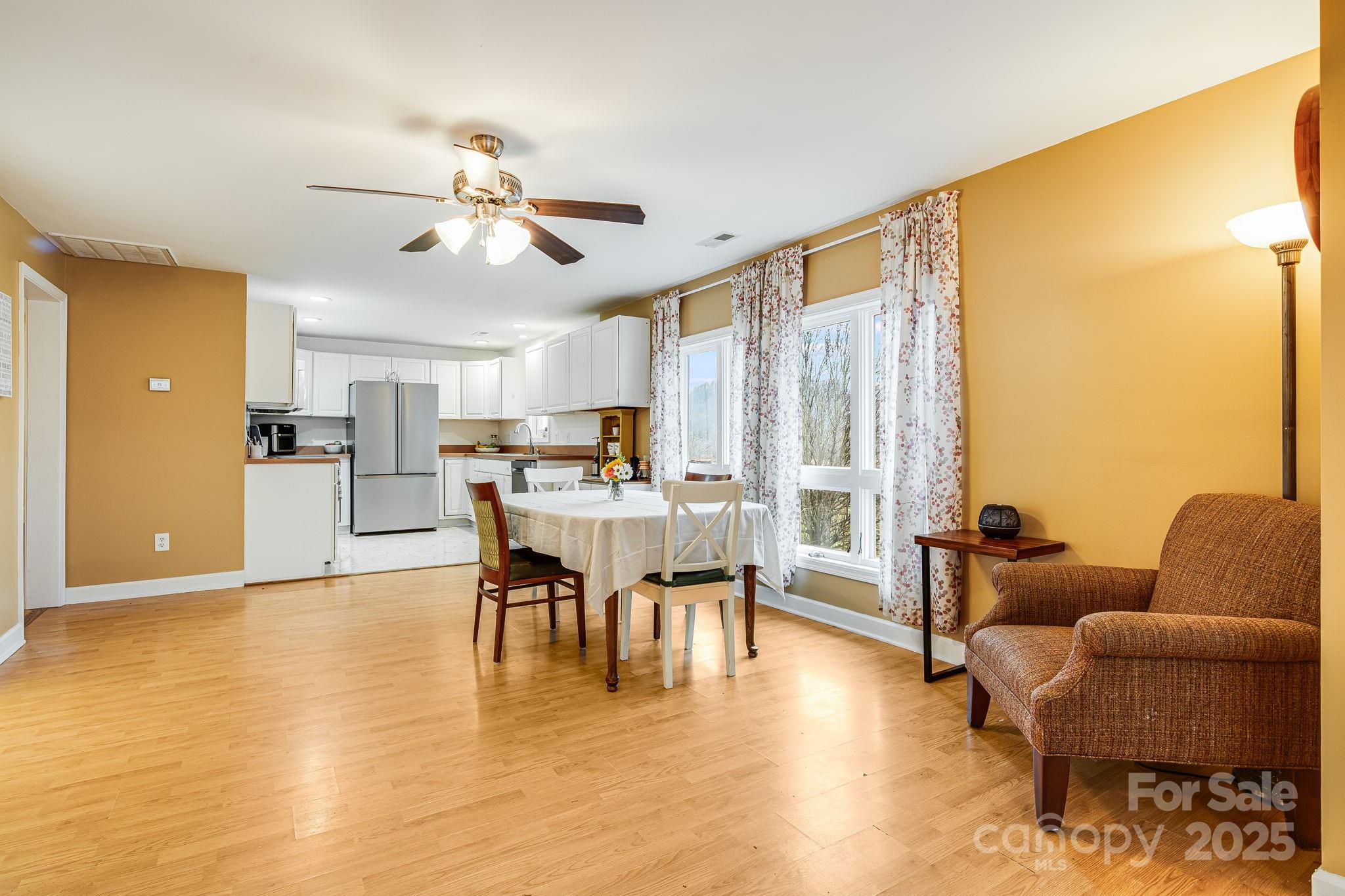 195 Whitmire Road Brevard, NC 28712 - Photo 5 of 30 a dining room with furniture and wooden floor