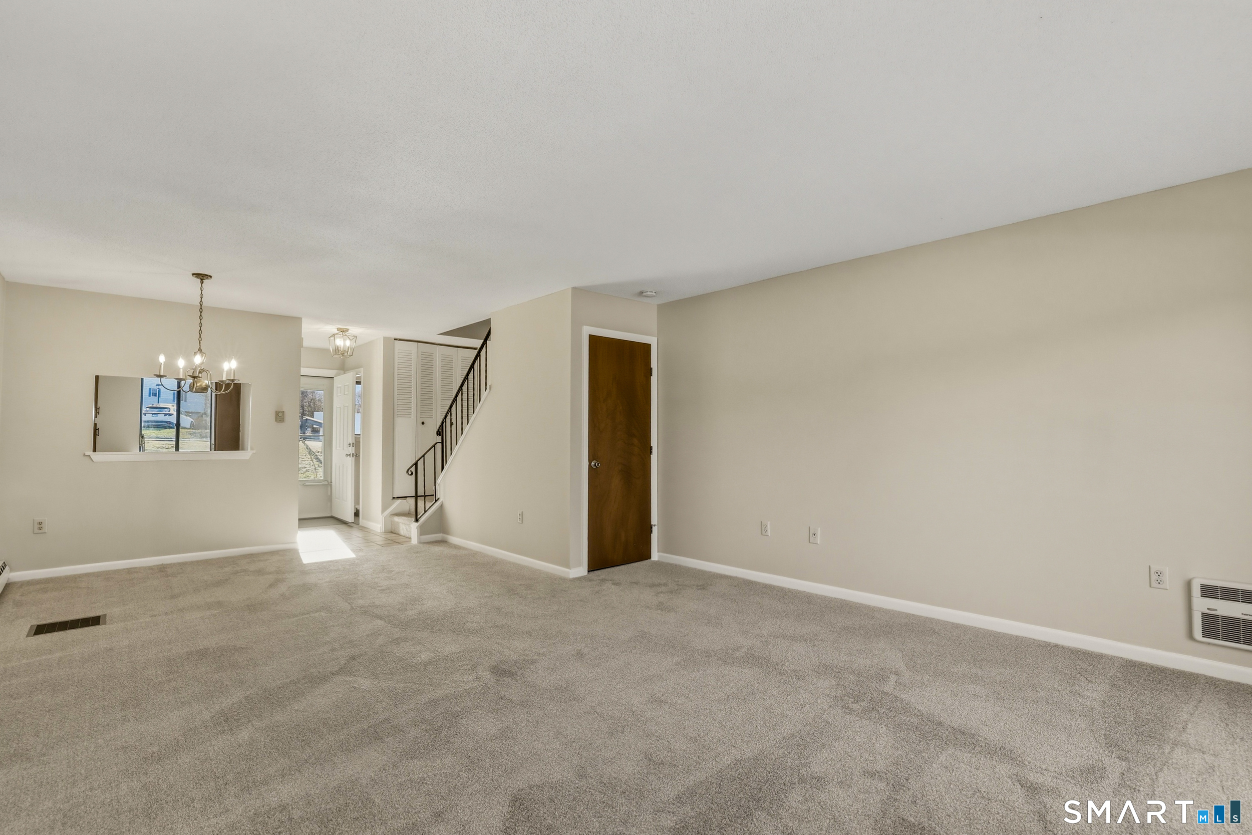 412 South Main Street, Unit 15 Plymouth, CT 06786 - Photo 13 of 28 a view of an empty room with a fireplace