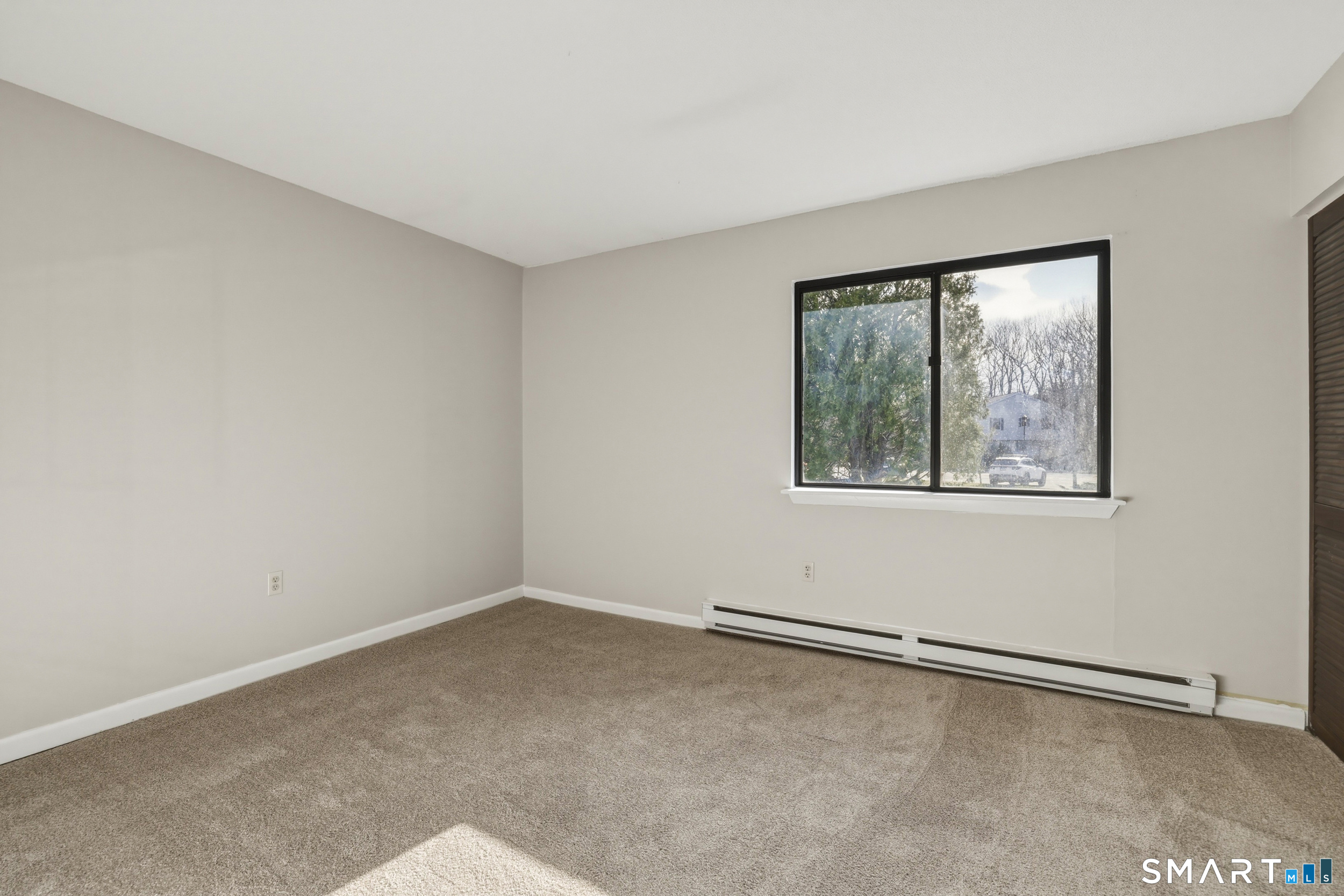 412 South Main Street, Unit 15 Plymouth, CT 06786 - Photo 15 of 28 an empty room with a window