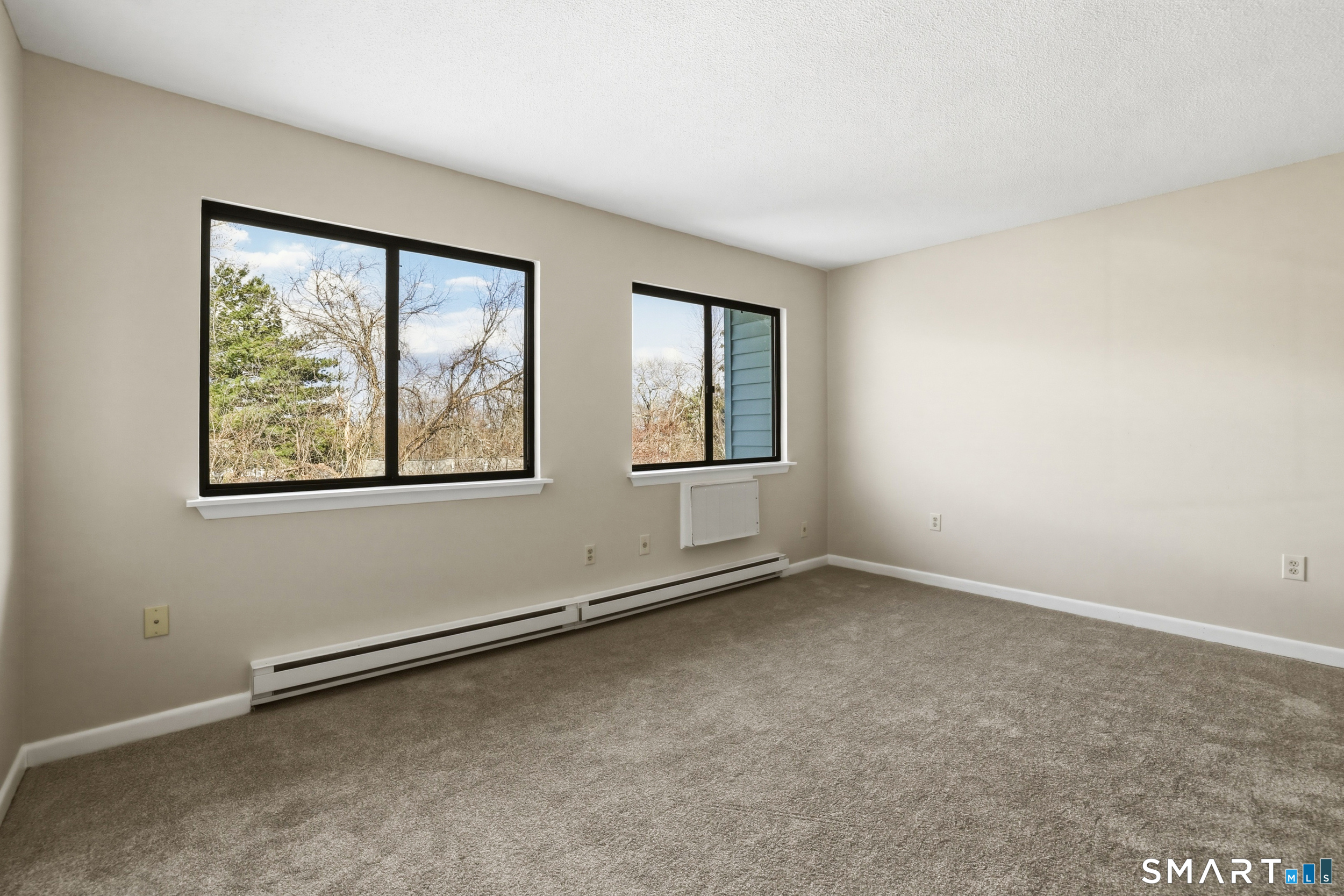 412 South Main Street, Unit 15 Plymouth, CT 06786 - Photo 18 of 28 an empty room with windows