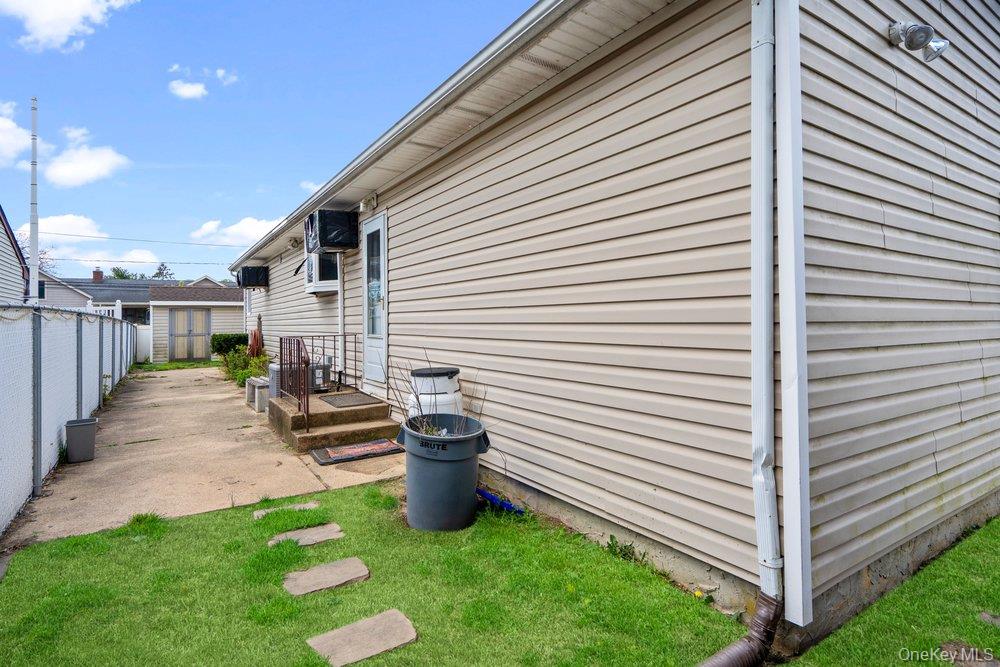 101 Sexton Road West Babylon, NY 11704 - Photo 26 of 33 a view of a patio with chair and table