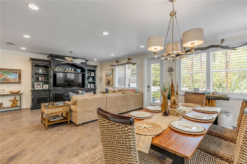 123 Marina Bay Drive New Smyrna Beach, FL 32169 - Photo 12 of 84 a living room with furniture a flat screen tv and a large window