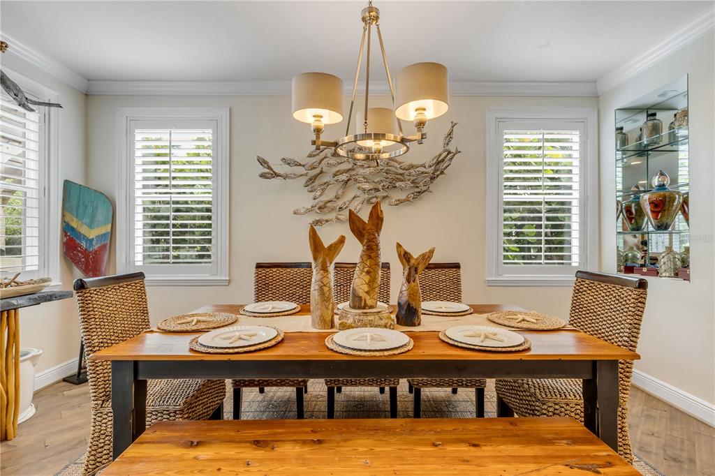 123 Marina Bay Drive New Smyrna Beach, FL 32169 - Photo 15 of 84 a view of a dining room with furniture and chandelier