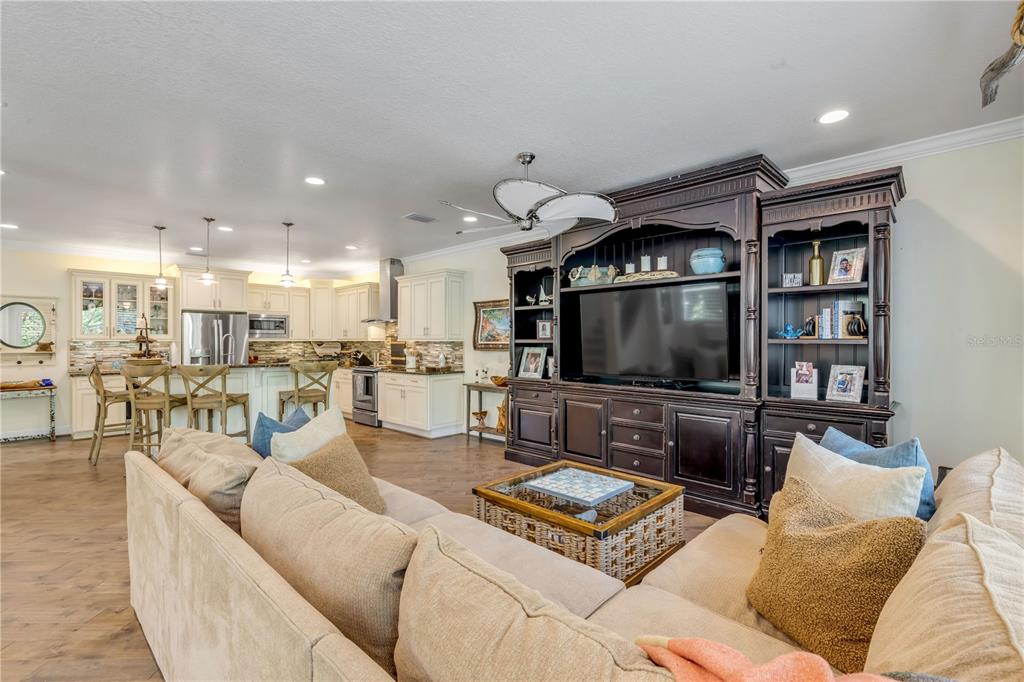 123 Marina Bay Drive New Smyrna Beach, FL 32169 - Photo 16 of 84 a living room with furniture and a flat screen tv