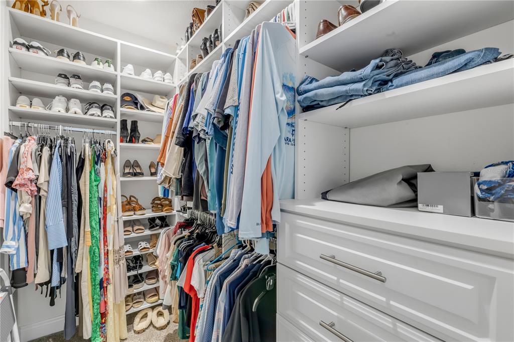 123 Marina Bay Drive New Smyrna Beach, FL 32169 - Photo 39 of 84 a view of walk in closet with clothes and shoes