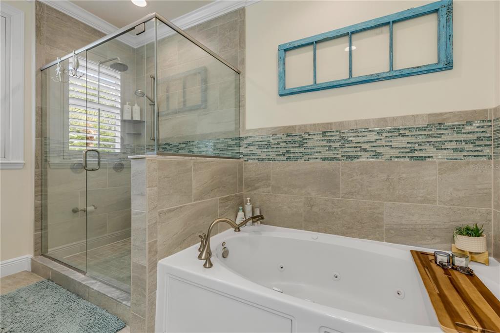 123 Marina Bay Drive New Smyrna Beach, FL 32169 - Photo 43 of 84 a bathroom with a bathtub and shower