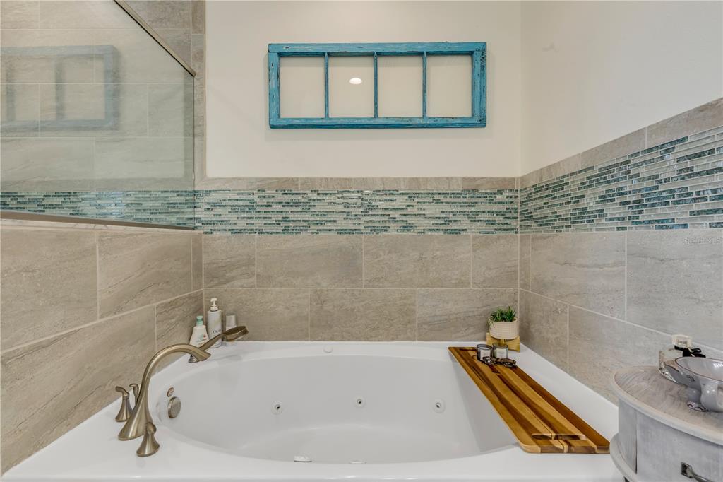 123 Marina Bay Drive New Smyrna Beach, FL 32169 - Photo 44 of 84 a bathroom with a tub and a sink