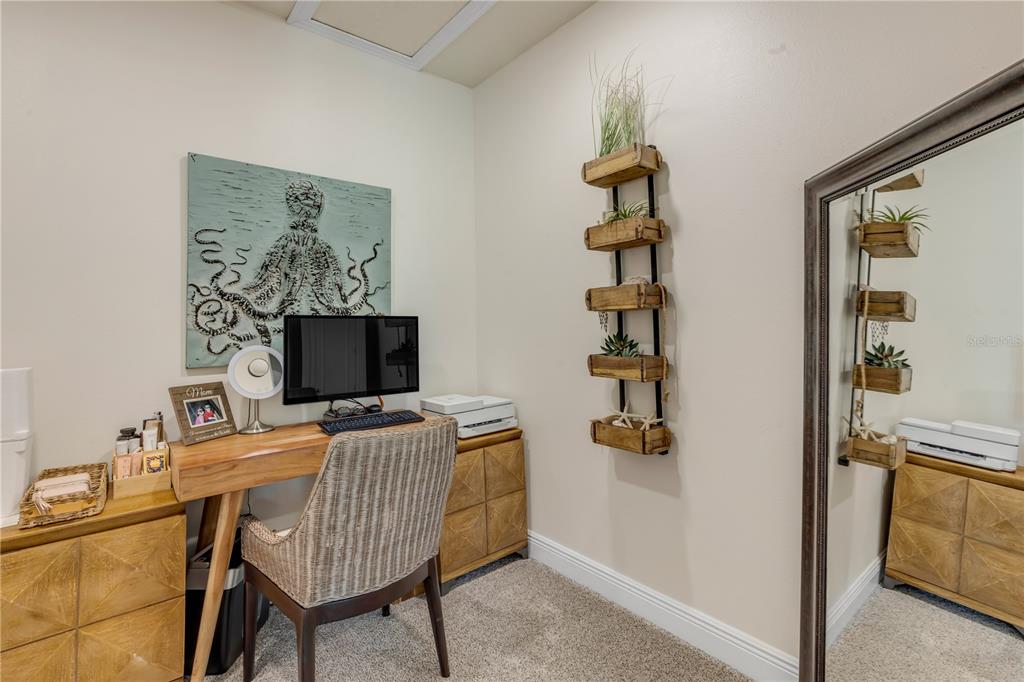 123 Marina Bay Drive New Smyrna Beach, FL 32169 - Photo 47 of 84 a workspace with furniture and wooden floor