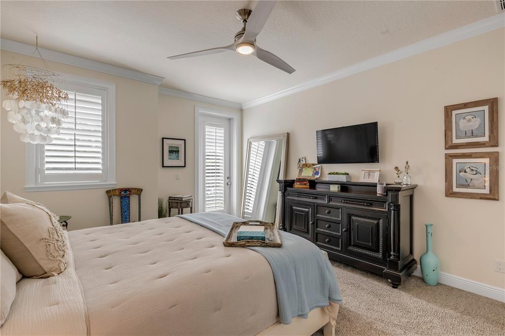 123 Marina Bay Drive New Smyrna Beach, FL 32169 - Photo 50 of 84 a bedroom with a bed and a flat screen tv