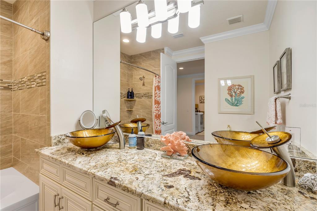 123 Marina Bay Drive New Smyrna Beach, FL 32169 - Photo 56 of 84 a living room with granite countertop furniture a mirror and a table