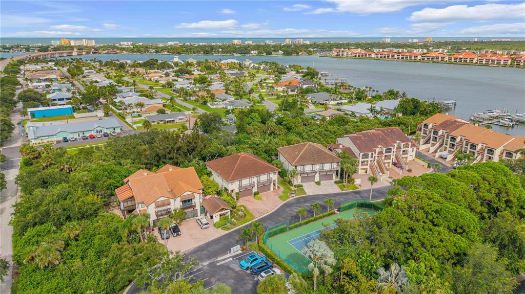 123 Marina Bay Drive New Smyrna Beach, FL 32169 - Photo 68 of 84 an aerial view of residential houses with outdoor space and seating