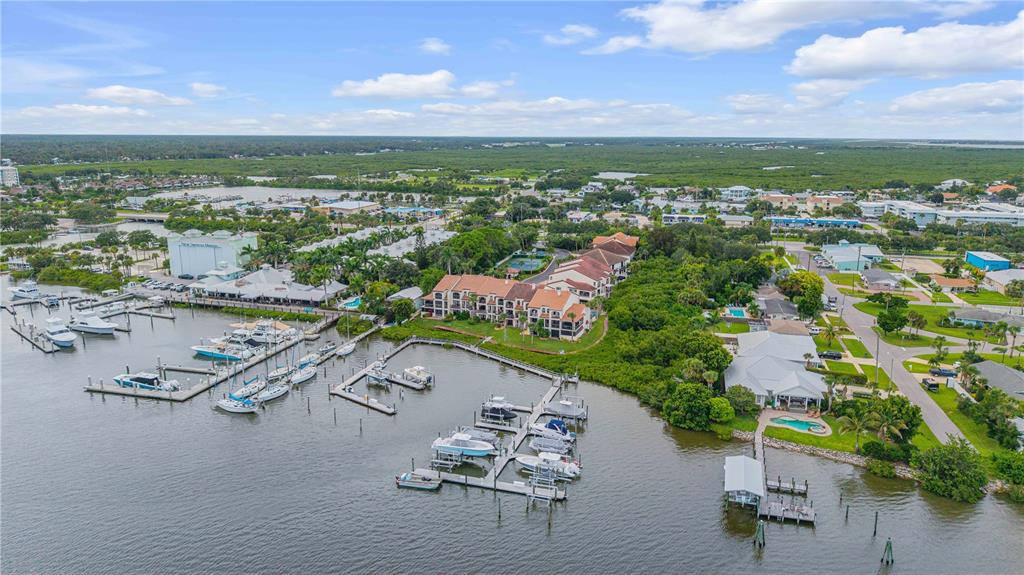 123 Marina Bay Drive New Smyrna Beach, FL 32169 - Photo 73 of 84 an aerial view of a city with streets and houses