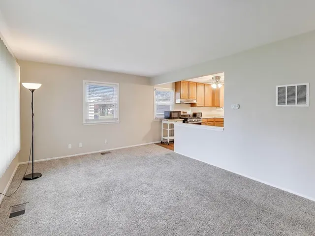 a view of a kitchen with a sink cabinets and a window
