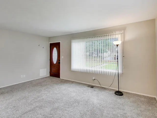 an empty room with sliding door