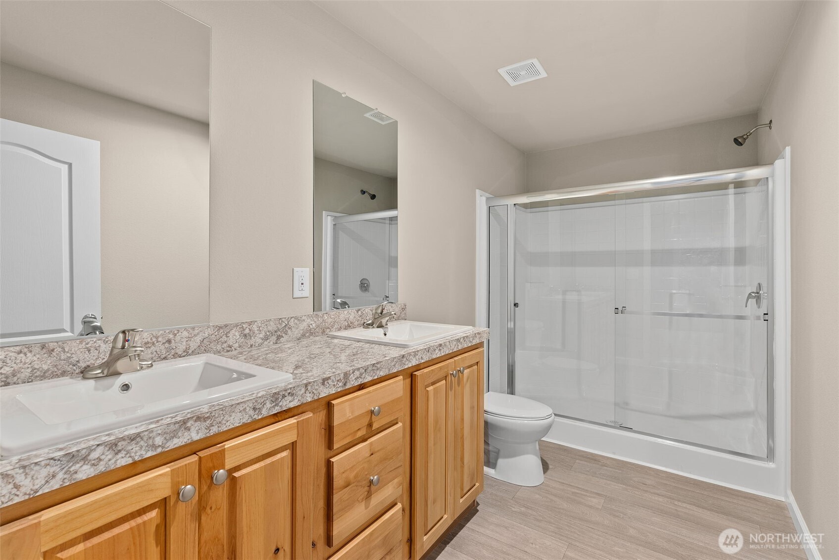 141 East Dalkeith Road Shelton, WA 98584 - Photo 17 of 38 a bathroom with a granite countertop sink a toilet and shower