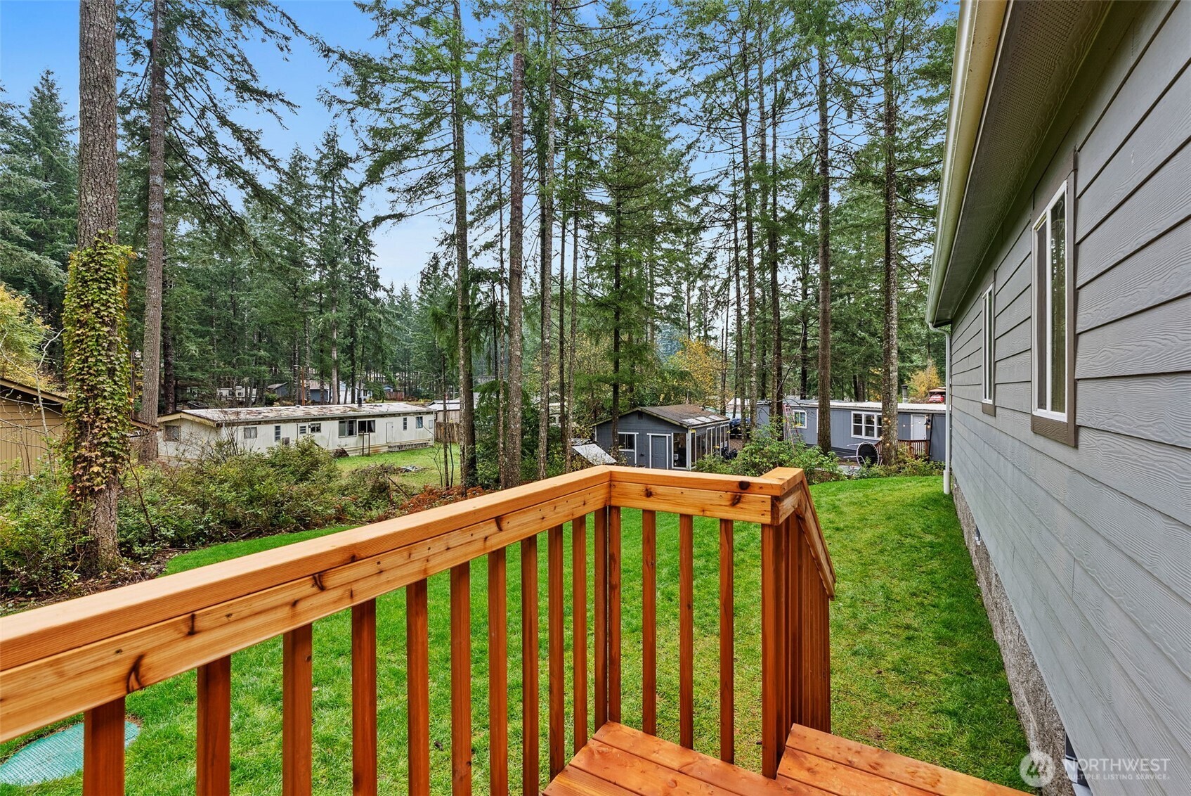 141 East Dalkeith Road Shelton, WA 98584 - Photo 28 of 38 a view of a wooden deck and a yard
