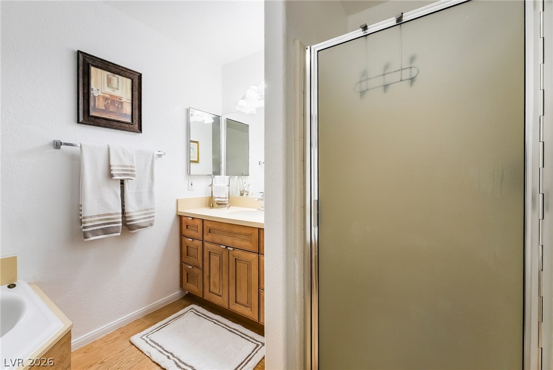 3631 South Blagg Road Pahrump, NV 89048 - Photo 24 of 47 A sleek, contemporary bathroom with a full vanity and a spacious shower enclosure.