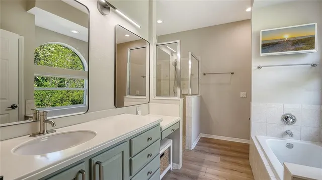 a bathroom with a sink and a bathtub