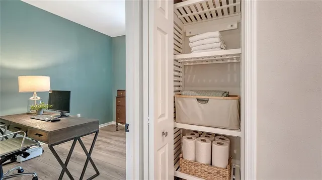 a view of an entryway with table and mirror