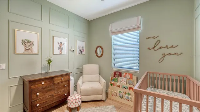 a bedroom with furniture and wooden floor