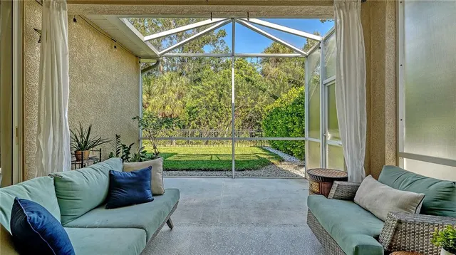 a living room with furniture and a yard