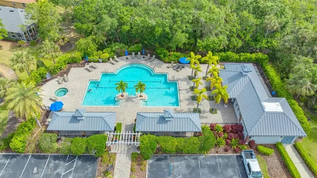 an aerial view of a house with a swimming pool