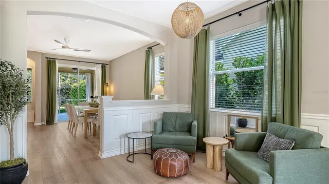 a living room with furniture and a large window