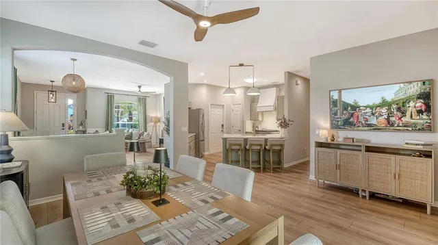 a living room with stainless steel appliances kitchen island granite countertop furniture and a kitchen view