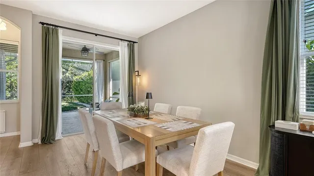 a view of a dining room with furniture and window