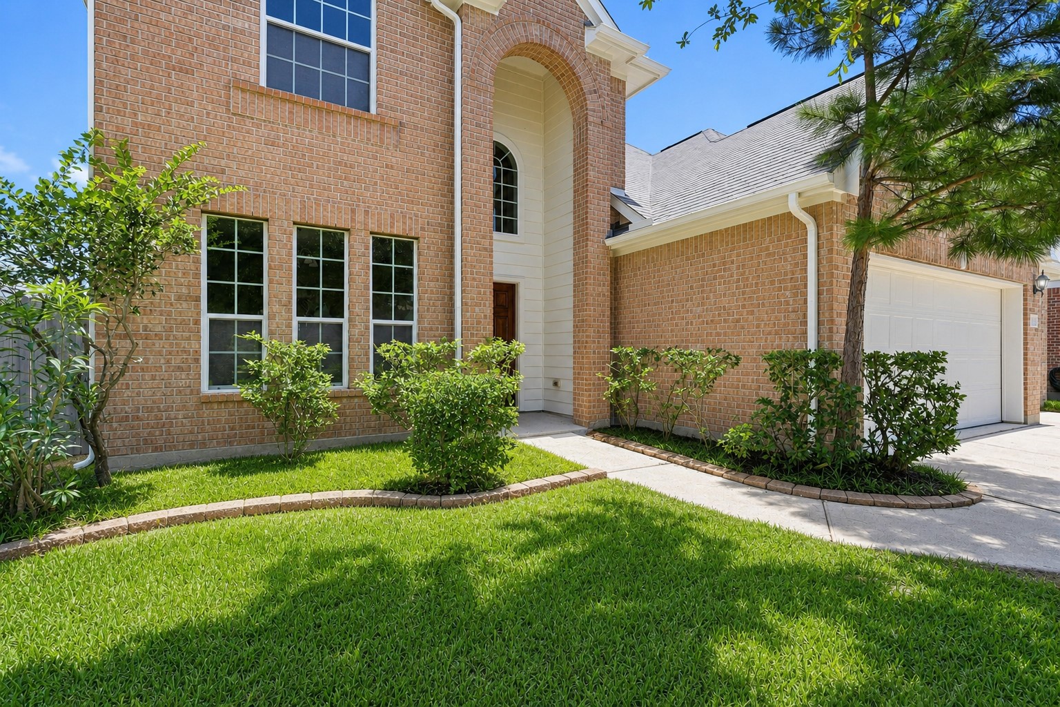 25926 Morgan Springs Spring, TX 77373 - Photo 3 of 49 The impressive covered front entry showcases soaring architectural details, stately columns, elegant arched accents, and a welcoming walkway surrounded by mature landscaping, creating a grand entrance your guests are sure to appreciate. Fully gutter system and more!