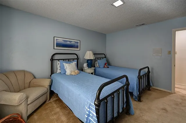 a bedroom with furniture and wooden floor