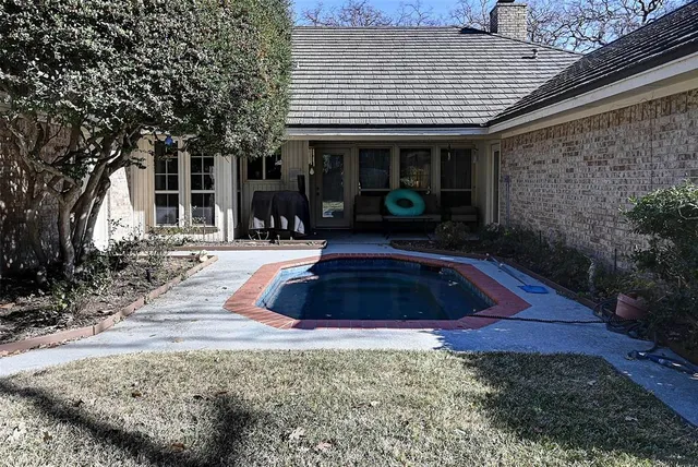 a front view of house with yard and sitting area