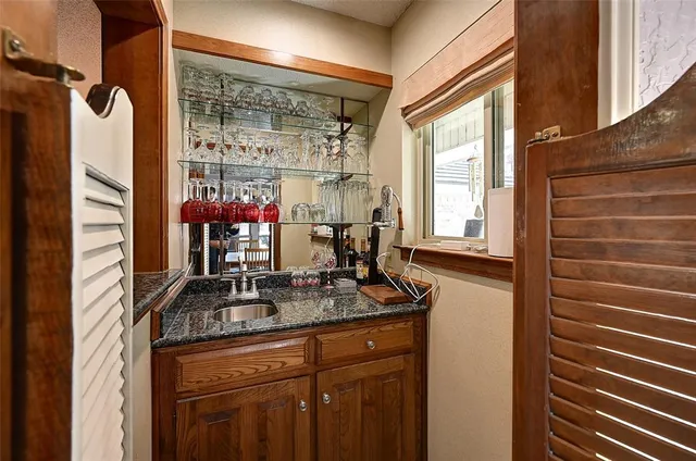 a kitchen with a refrigerator and a sink