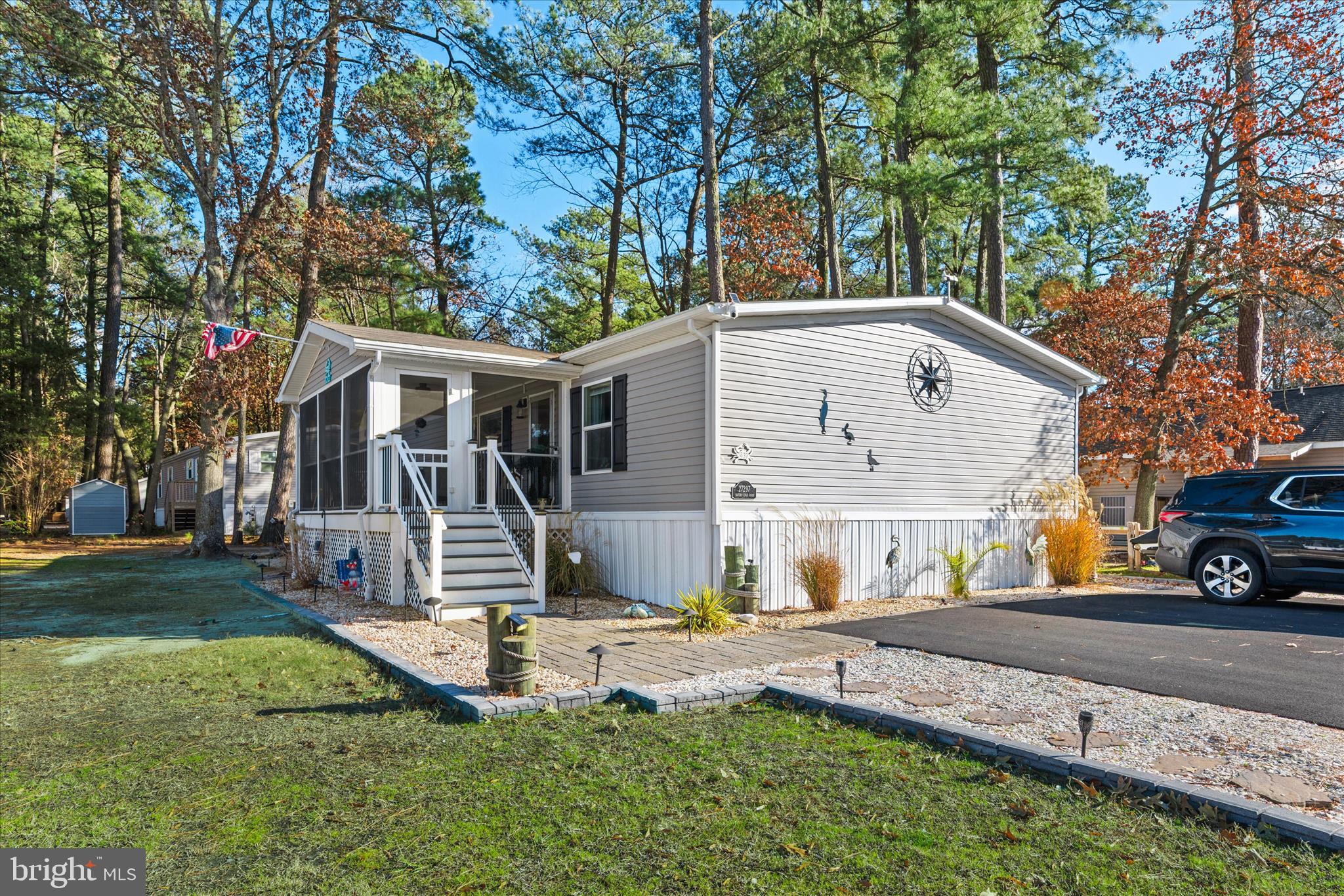 27297 Waters Edge Road Millsboro, DE 19966 - Photo 2 of 46 a view of house and outdoor space with yard