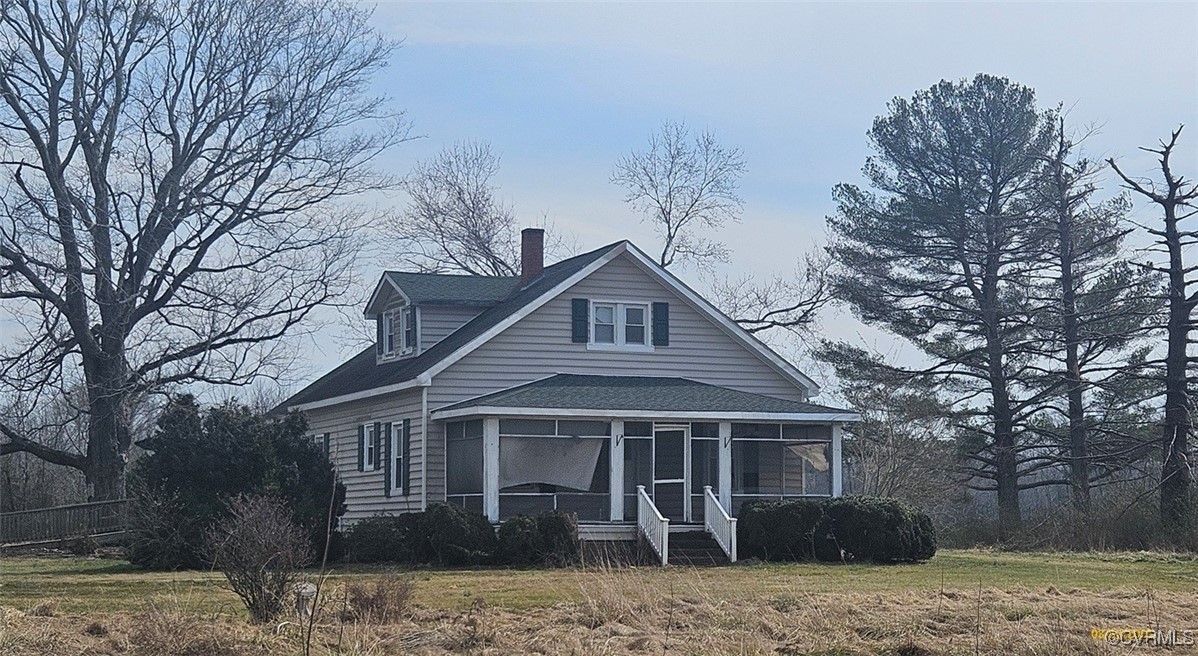 View of front of property featuring roof with shin